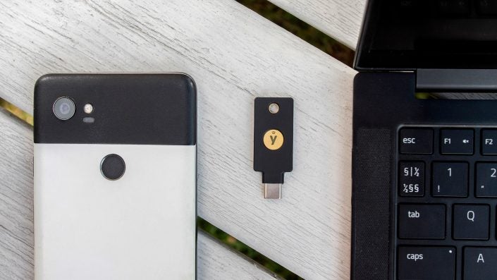 YubiKey 5CNFC with phone and laptop