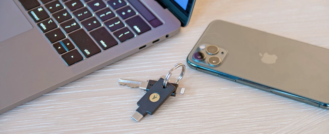 laptop, YubiKey 5C NFC, cell phone