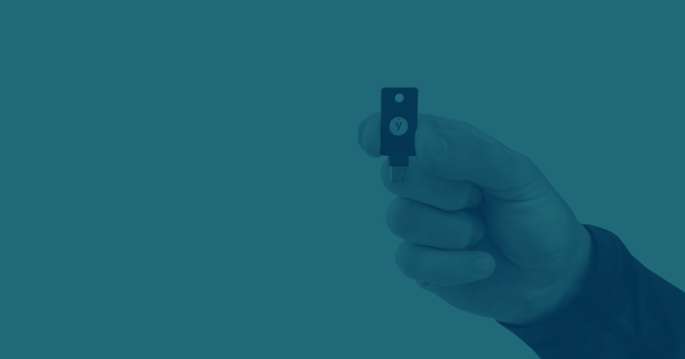 Hand holding a YubiKey