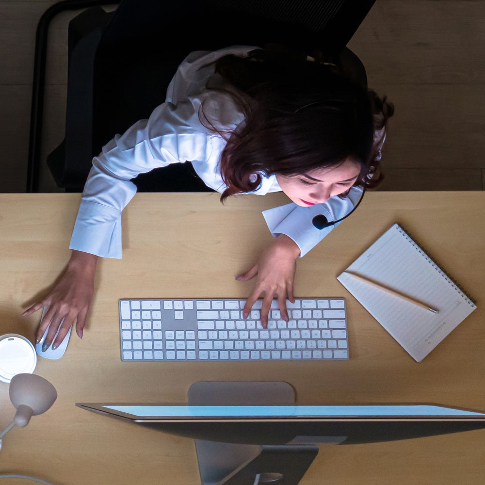 overhead image of woman working on computer