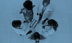 medical staff standing in a circle