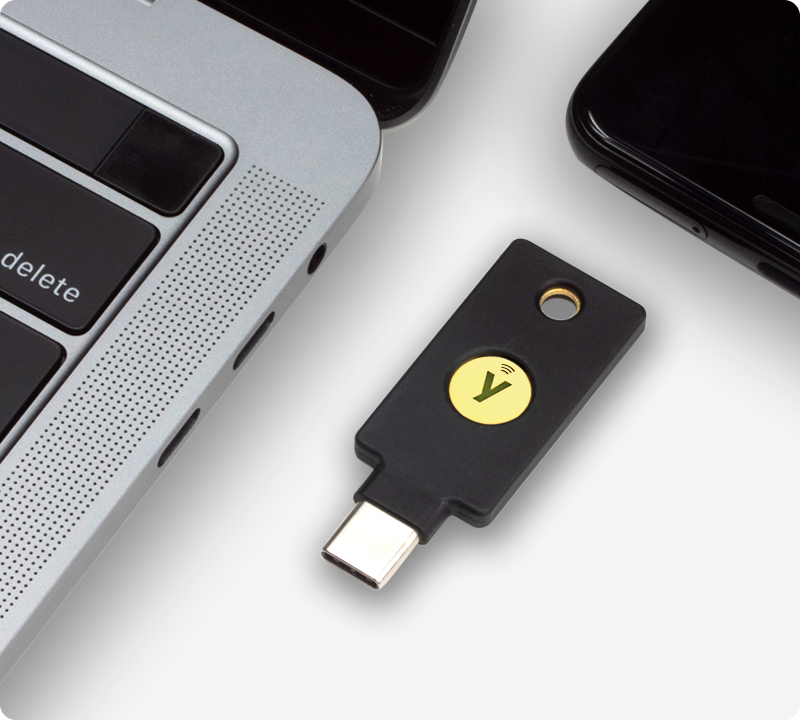 YubiKey 5C NFC next to laptop
