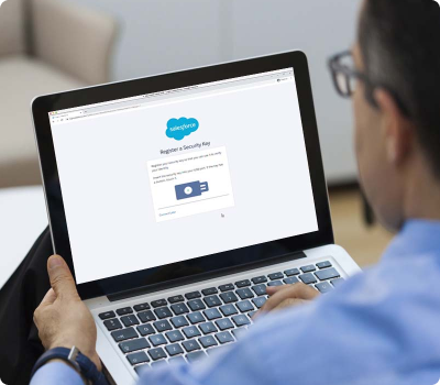 man on laptop logging into Salesforce with YubiKey
