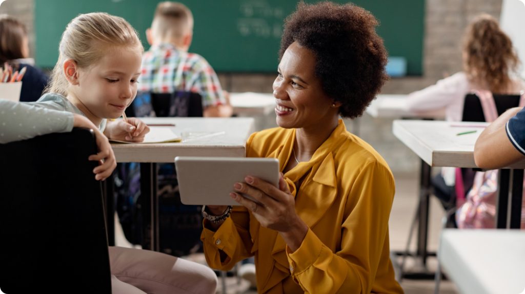 teacher helping student