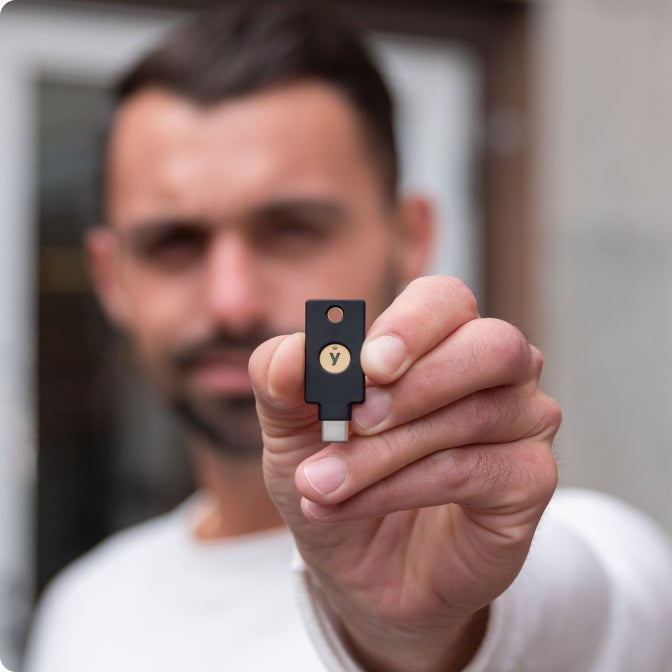 man holding YubiKey