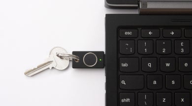 YubiKey on a keychain plugged into a laptop