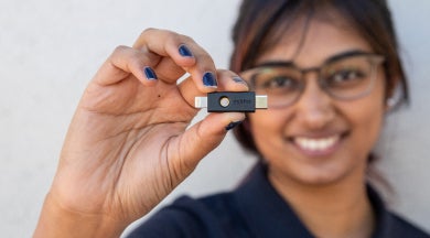 Woman holding YubiKey 5ci