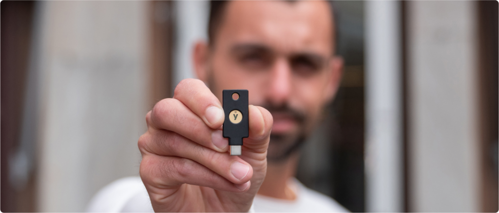 man holding YubiKey